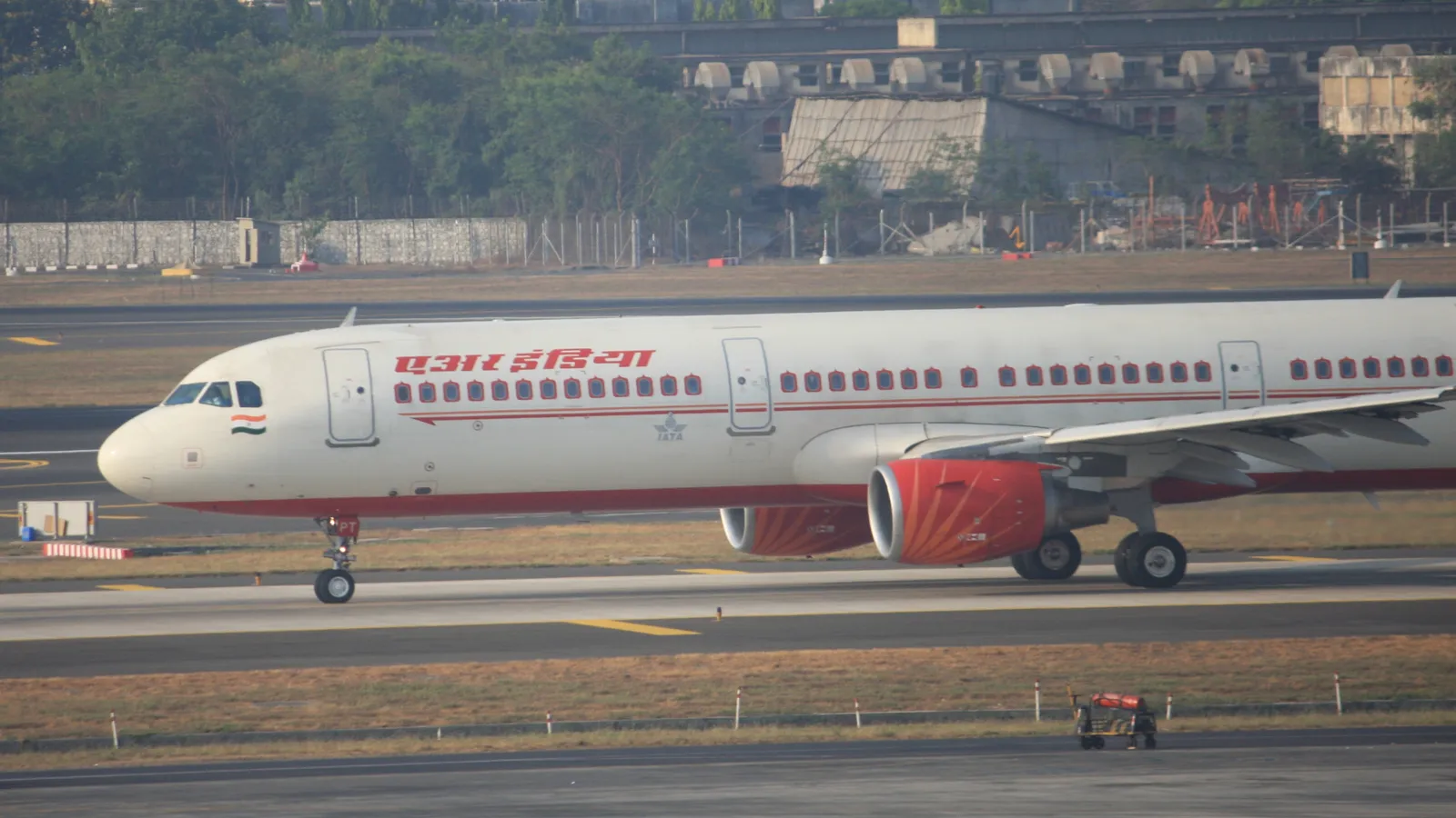 An Air India Airbus A321-211 in the carrier's red-and-white livery taxiing at Mumbai's Chhatrapati Shivaji International Airport, the aircraft type being converted for the AEW&C Mk-II programme.