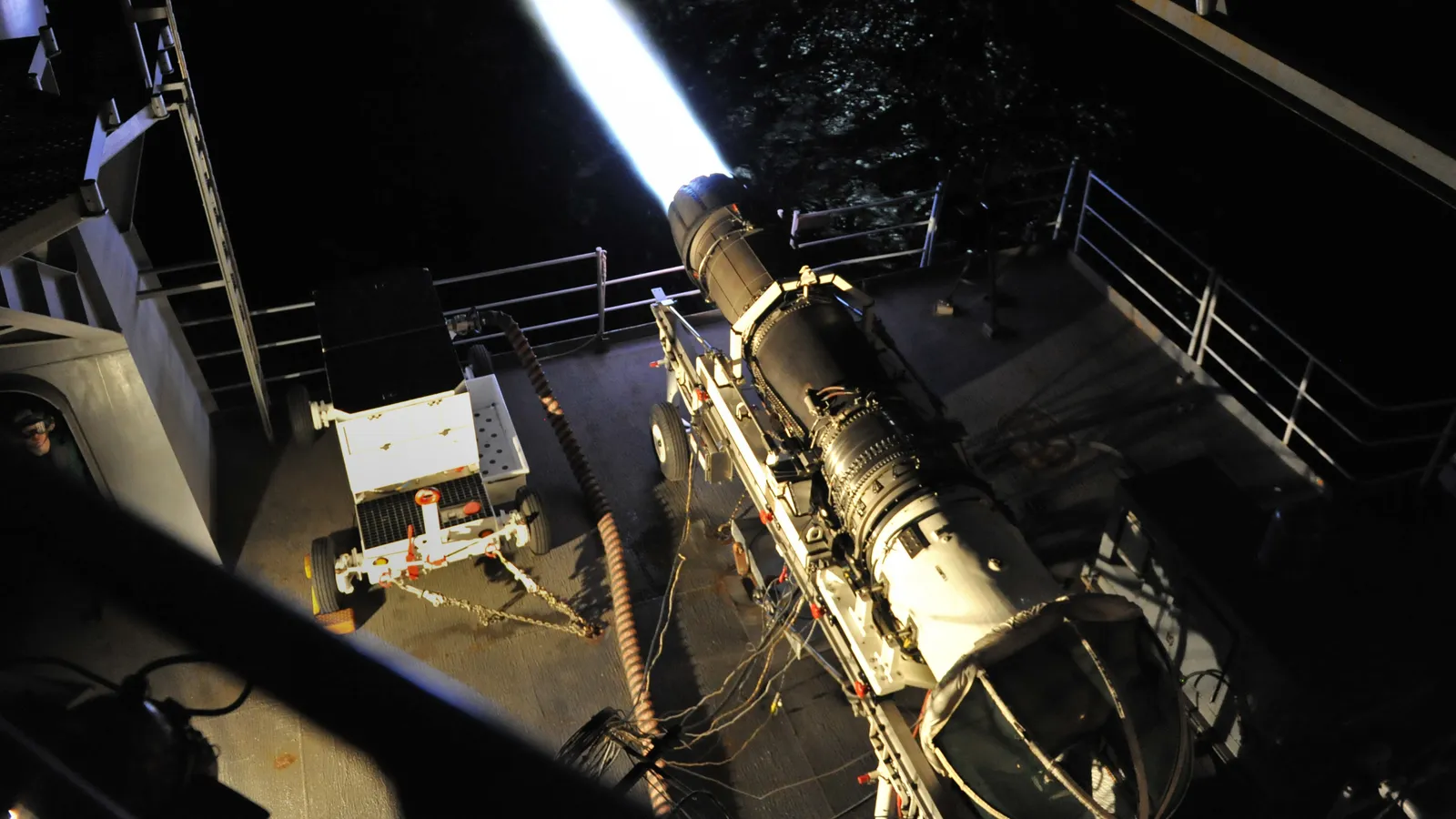 A GE F414-GE-400 engine in full afterburner during a test on the fantail of the aircraft carrier USS John C. Stennis.