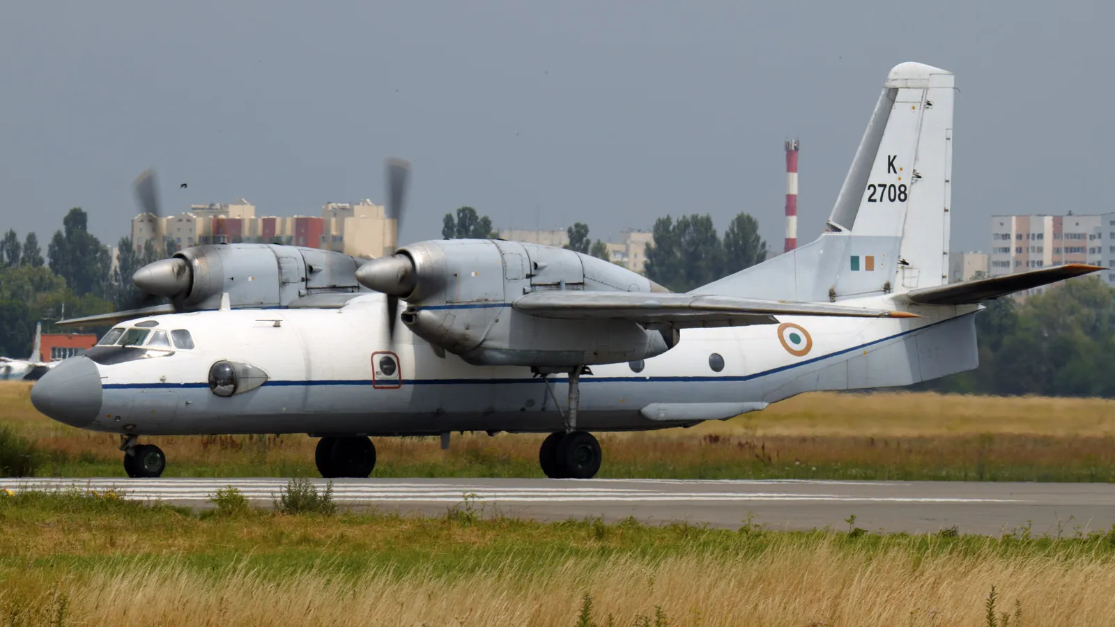 An Indian Air Force Antonov An-32 transport aircraft, tail number K2708, taxiing on a runway with both turboprops running.