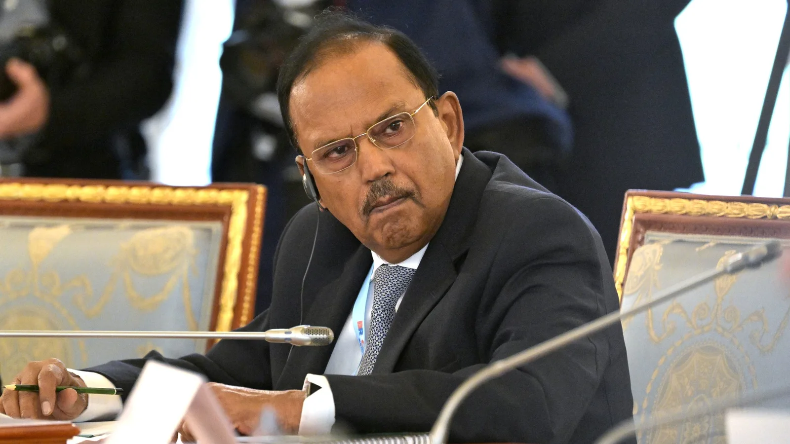 National Security Adviser Ajit Doval seated at a conference table with a microphone during a multilateral national security advisers' meeting.