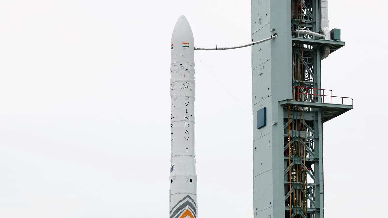 Skyroot's Vikram-1 rocket on the launch pad at Satish Dhawan Space Centre, its nose cone bearing the Indian flag beside the launch tower.